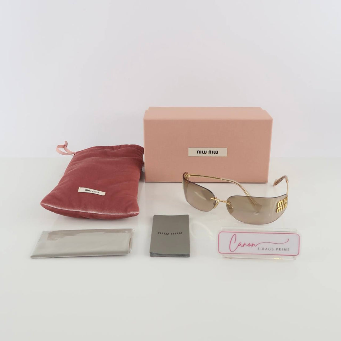 MU A51S Feature Rimless Rectangular Lenses And Gold Tone Logo Lettering On The Temples Sunglasses 75mm