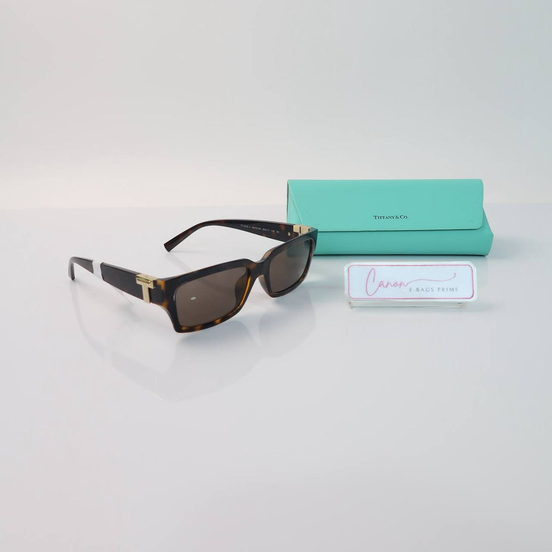Rectangular Sunglasses in a Tortoise Shell Frame and Solid Brown Lenses