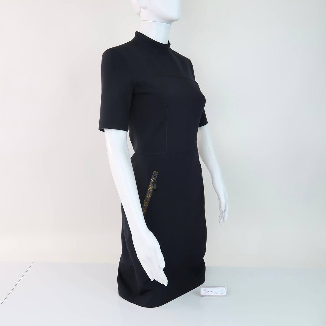Short-Sleeved High-Heck Fitted Dress Featuring Monogram-Patterned Zipper Pulls on the Front Pockets